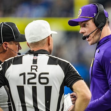 Minnesota Vikings head coach Kevin O’Connell speaks with officials.