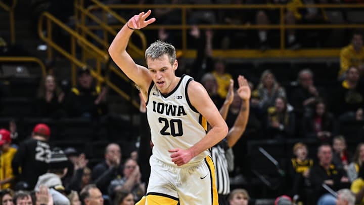 Dec 30, 2024; Iowa City, Iowa, USA; Iowa Hawkeyes forward Payton Sandfort (20) reacts during the first half against the New Hampshire Wildcats at Carver-Hawkeye Arena. Mandatory Credit: Jeffrey Becker-Imagn Images Dec 30, 2024; Iowa City, Iowa, USA; Iowa Hawkeyes forward Payton Sandfort (20) reacts during the first half against the New Hampshire Wildcats at Carver-Hawkeye Arena. Mandatory Credit: Jeffrey Becker-Imagn Images