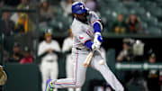 Apr 23, 2025; West Sacramento, California, USA; Texas Rangers right fielder Adolis Garcia (53) hits a ground ball to record an RBI against the Athletics in the sixth inning at Sutter Health Park. 