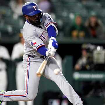 Apr 23, 2025; West Sacramento, California, USA; Texas Rangers right fielder Adolis Garcia (53) hits a ground ball to record an RBI against the Athletics in the sixth inning at Sutter Health Park.