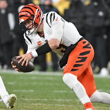 Jan 4, 2025; Pittsburgh, Pennsylvania, USA; Pittsburgh Steelers defensive tackle Keeanu Benton (95) tackles Cincinnati Bengals quarterback Joe Burrow (9) during the fourth quarter at Acrisure Stadium. Mandatory Credit: Barry Reeger-Imagn Images