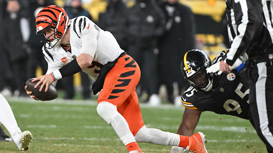 Jan 4, 2025; Pittsburgh, Pennsylvania, USA; Pittsburgh Steelers defensive tackle Keeanu Benton (95) tackles Cincinnati Bengals quarterback Joe Burrow (9) during the fourth quarter at Acrisure Stadium. Mandatory Credit: Barry Reeger-Imagn Images | Barry Reeger-Imagn Images