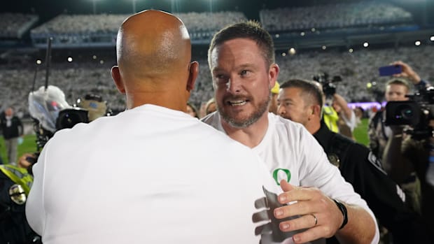 Oregon Ducks coach Dan Lanning greets Penn State Nittany Lions coach James Franklin following a win at Beaver Stadium.