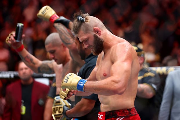 Jiri Prochazka (blue gloves) reacts after losing to Alex Pereira (red gloves) during UFC 303 at T-Mobile Arena. 