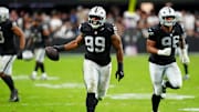 Las Vegas Raiders defensive tackle Thomas Booker (99) reacts after a play during the second half against the Tennessee Titans at Allegiant Stadium.