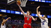 Oct 25, 2025; Orlando, Florida, USA;  Chicago Bulls guard Josh Giddey (3) takes a shot as Orlando Magic center Goga Bitadze (35) tries to defend in the second half at Kia Center. Mandatory Credit: Russell Lansford-Imagn Images