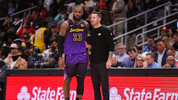 Dec 6, 2024; Atlanta, Georgia, USA; Los Angeles Lakers forward LeBron James (23) talks to head coach JJ Redick against the Atlanta Hawks in the second quarter at State Farm Arena. Mandatory Credit: Brett Davis-Imagn Images