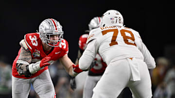 Jan 10, 2025; Arlington, TX, USA; Ohio State Buckeyes defensive end Jack Sawyer (33) rushes against Texas Longhorns offensive lineman Kelvin Banks Jr. (78) during the game at AT&T Stadium. Mandatory Credit: Jerome Miron-Imagn Images