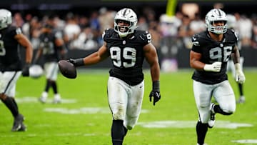 Las Vegas Raiders defensive tackle Thomas Booker (99) reacts after a play during the second half against the Tennessee Titans at Allegiant Stadium.