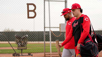 Cincinnati Reds non-roster invitee Sal Stewart walks with Barry Larkin between fields at the Cincinnati Reds Player Development Complex in Goodyear, Ariz., on Wednesday, Feb. 12, 2025.