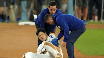 Oct 26, 2024; Los Angeles, California, USA; Los Angeles Dodgers designated hitter Shohei Ohtani (17) reacts after injuring his shoulder against the New York Yankees in the seventh inning for game two of the 2024 MLB World Series at Dodger Stadium. Mandatory Credit: Kirby Lee-Imagn Images