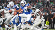 Aug 24, 2023; Philadelphia, Pennsylvania, USA; Indianapolis Colts running back Kenyan Drake (31) leaps over Philadelphia Eagles defensive tackle Caleb Sanders (67) during the fourth quarter at Lincoln Financial Field. Mandatory Credit: Eric Hartline-USA TODAY Sports