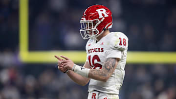 Dec 26, 2024; Phoenix, AZ, USA; Rutgers Scarlet Knights quarterback Athan Kaliakmanis (16) reacts against the Kansas State Wildcats during the second half of the Rate Bowl at Chase Field. Mandatory Credit: Mark J. Rebilas-Imagn Images