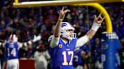 Buffalo Bills quarterback Josh Allen (17) celebrates with fans after his 81 yard touchdown pass to