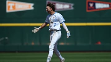 Jun 14, 2024; Omaha, NE, USA;  North Carolina Tar Heels center fielder Vance Honeycutt (7) celebrates after driving in the winning run against the Virginia Cavaliers during the ninth inning at Charles Schwab Filed Omaha. Mandatory Credit: Steven Branscombe-USA TODAY Sports