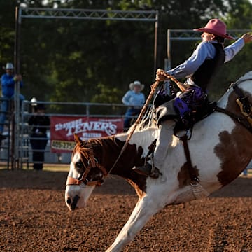 Jarod Torrence of Indian Trail, North Carolina, competes in saddle bronc during the International Finals Youth Rodeo in Shawnee, Okla., Wednesday, July 10, 2024.