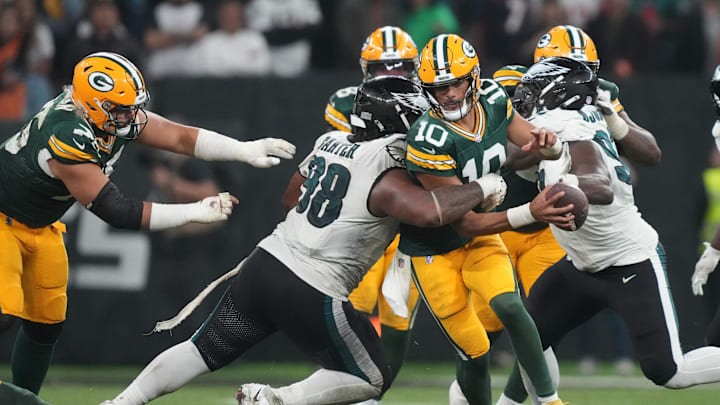 Green Bay Packers quarterback Jordan Love (10) is hit by Philadelphia Eagles defensive tackle Jalen Carter (98) on Friday.