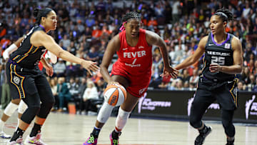 South Carolina basketball legend Aliyah Boston driving to the basket in the WNBA Playoffs