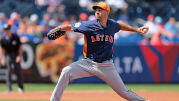 Feb 27, 2025; Port St. Lucie, Florida, USA; Houston Astros starting pitcher Colton Gordon (61) delivers a pitch against the New York Mets during the first inning at Clover Park. Mandatory Credit: Sam Navarro-Imagn Images