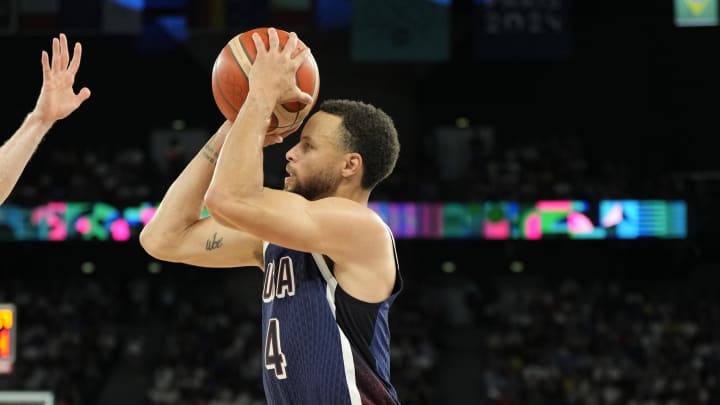 Aug 6, 2024; Paris, France; United States shooting guard Stephen Curry (4) shoot against Brazil in the first half in a men’s basketball quarterfinal game during the Paris 2024 Olympic Summer Games at Accor Arena. Mandatory Credit: Kyle Terada-USA TODAY Sports