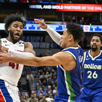 Jan 30, 2023; Dallas, Texas, USA; Dallas Mavericks guard Josh Green (8) looks to knock the ball away from Detroit Pistons forward Saddiq Bey (41) during the second half at the American Airlines Center. Mandatory Credit: Jerome Miron-USA TODAY Sports