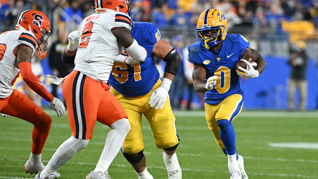 Oct 24, 2024; Pittsburgh, Pennsylvania, USA; Pittsburgh Panthers running back Desmond Reid (0) runs against the Syracuse Orange during the third quarter at Acrisure Stadium. Mandatory Credit: Barry Reeger-Imagn Images Oct 24, 2024; Pittsburgh, Pennsylvania, USA; Pittsburgh Panthers running back Desmond Reid (0) runs against the Syracuse Orange during the third quarter at Acrisure Stadium. Mandatory Credit: Barry Reeger-Imagn Images