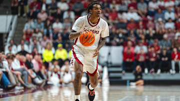 Feb 25, 2025; Tuscaloosa, Alabama, USA; Alabama Crimson Tide guard Labaron Philon (0) drives against the Mississippi State Bulldogs during the second half at Coleman Coliseum. Mandatory Credit: Will McLelland-Imagn Images
