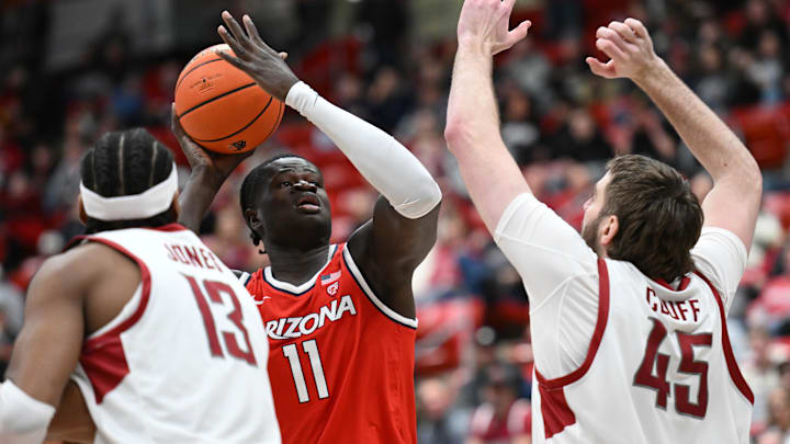 Arizona Wildcats center Oumar Ballo (11) shoots the ball against Washington State Cougars forward Oscar Cluff (45) in the first half at Friel Court at Beasley Coliseum.