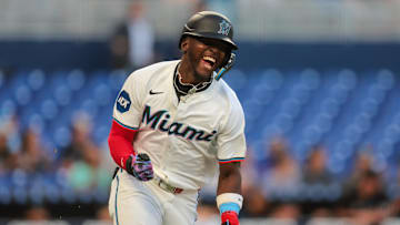 Apr 21, 2025; Miami, Florida, USA; Miami Marlins designated hitter Ronny Simon (41) reacts after hitting an RBI single against the Cincinnati Reds during the second inning at loanDepot Park. Mandatory Credit: Sam Navarro-Imagn Images