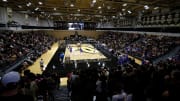 Purdue fans watch during an NCAA volleyball match 