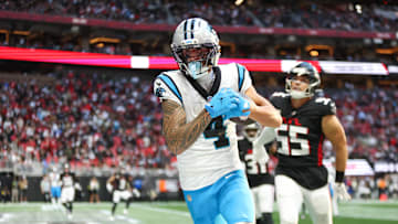 Nov 16, 2025; Atlanta, Georgia, USA; Carolina Panthers wide receiver Tetairoa McMillan (4) catches the ball for a touchdown in the fourth quarter against the Atlanta Falcons at Mercedes-Benz Stadium. Mandatory Credit: Brett Davis-Imagn Images