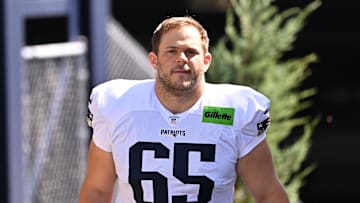 Jul 28, 2025; Foxborough, MA, USA; New England Patriots center Garrett Bradbury (65) heads to the practice fields for training camp at Gillette Stadium. Mandatory Credit: Eric Canha-Imagn Images