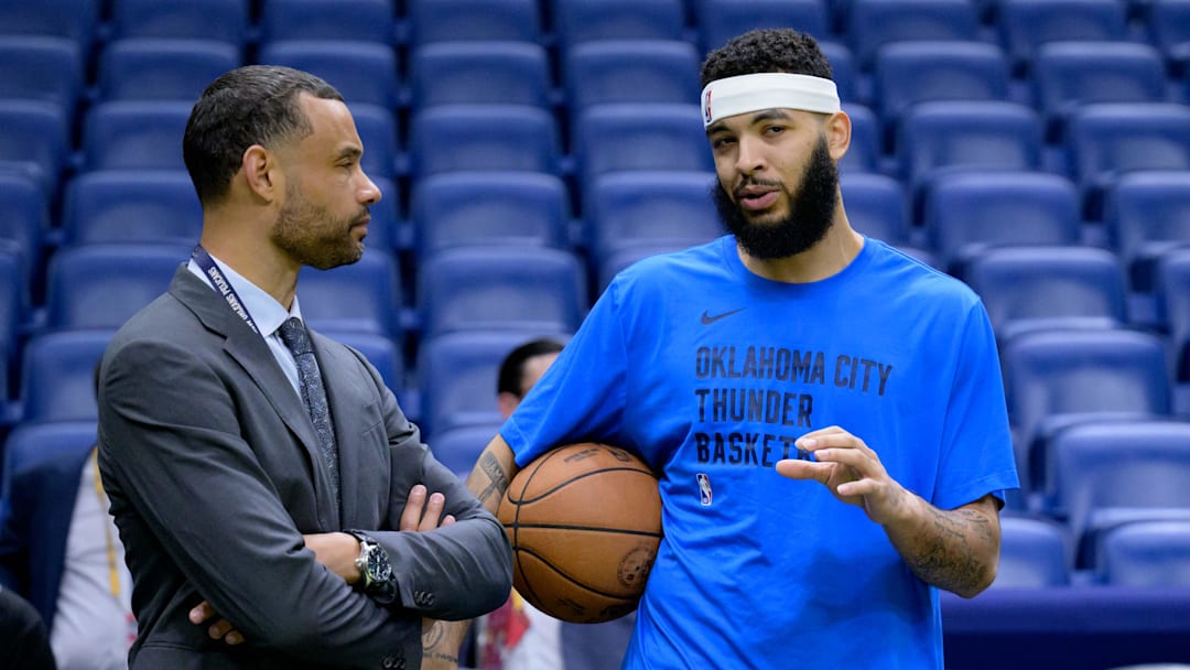 Mar 26, 2024; New Orleans, Louisiana, USA; Trajan Langdon, the general manager of the New Orleans Pelicans, left, talks with Oklahoma City Thunder forward Kenrich Williams (34) before a game at Smoothie King Center. Mandatory Credit: Matthew Hinton-Imagn Images Mar 26, 2024; New Orleans, Louisiana, USA; Trajan Langdon, the general manager of the New Orleans Pelicans, left, talks with Oklahoma City Thunder forward Kenrich Williams (34) before a game at Smoothie King Center. Mandatory Credit: Matthew Hinton-Imagn Images
