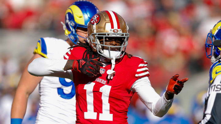 Jan 7, 2024; Santa Clara, California, USA; San Francisco 49ers wide receiver Brandon Aiyuk (11) celebrates after a play against the Los Angeles Rams during the first quarter at Levi's Stadium. Mandatory Credit: Sergio Estrada-USA TODAY Sports