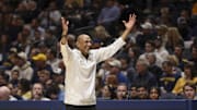Mar 8, 2025; Morgantown, West Virginia, USA; UCF Knights head coach Johnny Dawkins argues a call during the first half against the West Virginia Mountaineers at WVU Coliseum. Mandatory Credit: Ben Queen-Imagn Images