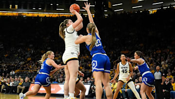 Iowa center Layla Hays (12) shoots as Drake forward Quinn Vice (23) defends Nov. 13, 2025 at Carver-Hawkeye Arena in Iowa City, Iowa.