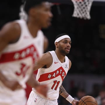 Mar 23, 2024; Washington, District of Columbia, USA;  Toronto Raptors forward Bruce Brown (11) dribbles upon the court during the second half against the Washington Wizards at Capital One Arena. Mandatory Credit: Tommy Gilligan-USA TODAY Sports