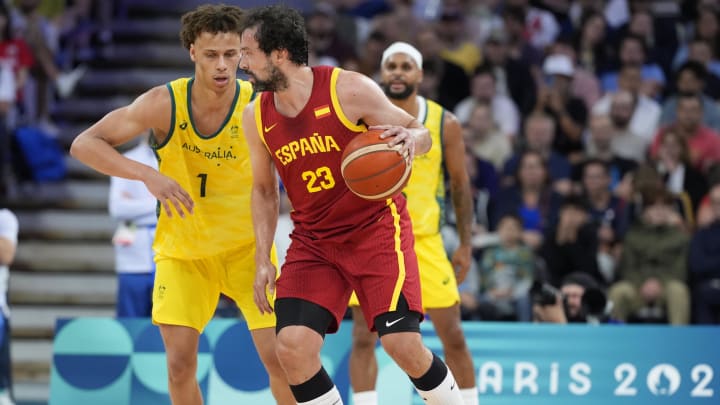 Jul 27, 2024; Villeneuve-d'Ascq, France; Spain guard Sergio Llull (23) is defended by Australia point guard Dyson Daniels (1)  in men's Group A play during the Paris 2024 Olympic Summer Games at Stade Pierre-Mauroy. Mandatory Credit: John David Mercer-USA TODAY Sports