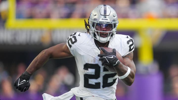 Aug 10, 2024; Minneapolis, Minnesota, USA; Las Vegas Raiders running back Alexander Mattison (22) runs with the ball against the Minnesota Vikings in the second quarter at U.S. Bank Stadium. Mandatory Credit: Brad Rempel-USA TODAY Sports