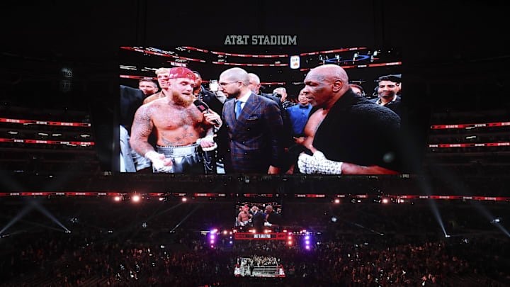 Legendary boxing champion Mike Tyson and social media star Jake Paul speak after the boxing match at Dallas' AT&T Stadium