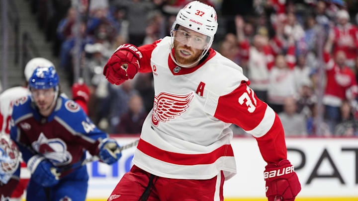 Mar 25, 2025; Denver, Colorado, USA; Detroit Red Wings left wing J.T. Compher (37) celebrates his goal scored in the first period against the Colorado Avalanche at Ball Arena. Mandatory Credit: Ron Chenoy-Imagn Images