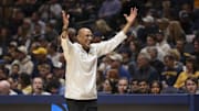 Mar 8, 2025; Morgantown, West Virginia, USA; UCF Knights head coach Johnny Dawkins argues a call during the first half against the West Virginia Mountaineers at WVU Coliseum. Mandatory Credit: Ben Queen-Imagn Images