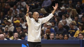 Mar 8, 2025; Morgantown, West Virginia, USA; UCF Knights head coach Johnny Dawkins argues a call during the first half against the West Virginia Mountaineers at WVU Coliseum. Mandatory Credit: Ben Queen-Imagn Images