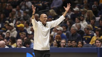 Mar 8, 2025; Morgantown, West Virginia, USA; UCF Knights head coach Johnny Dawkins argues a call during the first half against the West Virginia Mountaineers at WVU Coliseum. Mandatory Credit: Ben Queen-Imagn Images