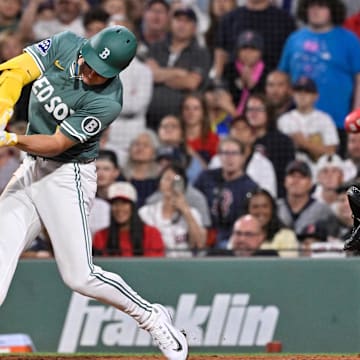 Aug 1, 2025; Boston, Massachusetts, USA; Boston Red Sox left fielder Roman Anthony (19) hits a game winning RBI against the Houston Astros during the tenth inning inning at Fenway Park. Mandatory Credit: Eric Canha-Imagn Images