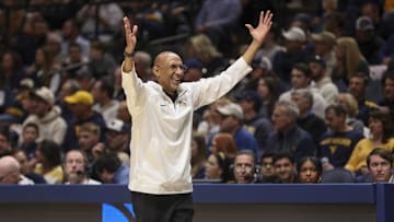 Mar 8, 2025; Morgantown, West Virginia, USA; UCF Knights head coach Johnny Dawkins argues a call during the first half against the West Virginia Mountaineers at WVU Coliseum. Mandatory Credit: Ben Queen-Imagn Images