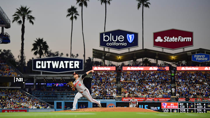 Aug 27, 2024; Los Angeles, California, USA; Baltimore Orioles pitcher Cole Irvin (19) throws against the Los Angeles Dodgers during the second inning at Dodger Stadium. Mandatory Credit: Gary A. Vasquez-Imagn Images