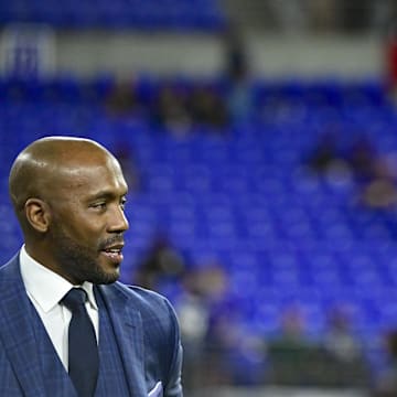 Oct 11, 2021; Baltimore, Maryland, USA; ESPN football analyst Louis Riddick  walks the field  at M&T Bank Stadium before the game between the Baltimore Ravens and the Indianapolis Colts. 