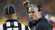Nov 4, 2023; Pittsburgh, Pennsylvania, USA;  Florida State Seminoles head coach Mike Norvell (right) gestures as he talks to head line judge Baron Baluster (left) against the Pittsburgh Panthers during the fourth quarter at Acrisure Stadium. The Seminoles won 24-7. Mandatory Credit: Charles LeClaire-Imagn Images