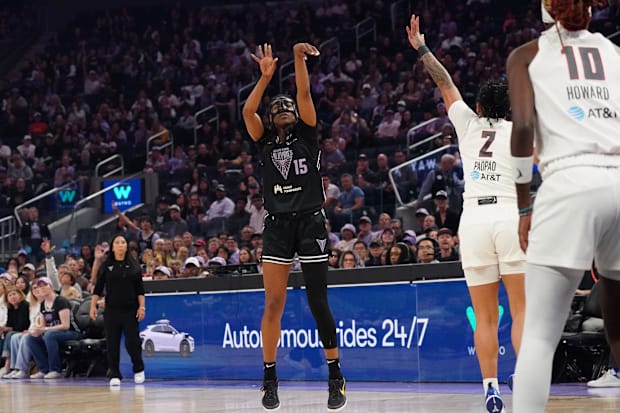 Golden State Valkyries guard Tiffany Hayes shoots a three pointer while defended by Atlanta Dream guard Te-Hina Paopao.